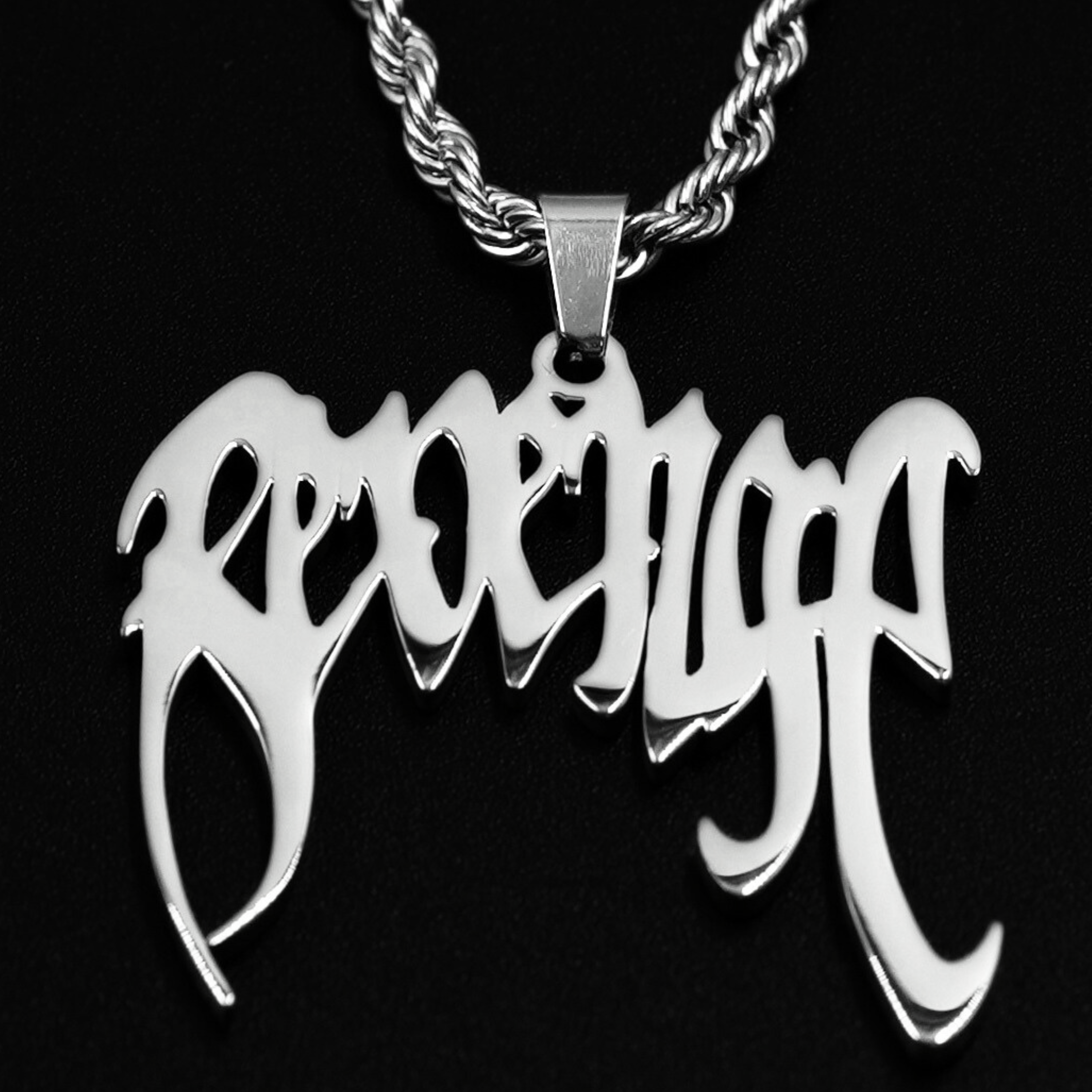 Black Revenge pendant necklace styled for dark hoodie outfits