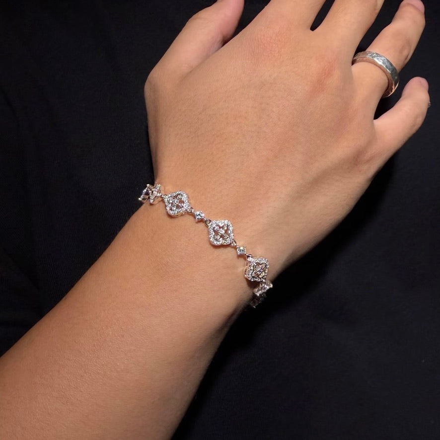 Silver-tone Crystal Quatrefoil Link Bracelet worn on wrist