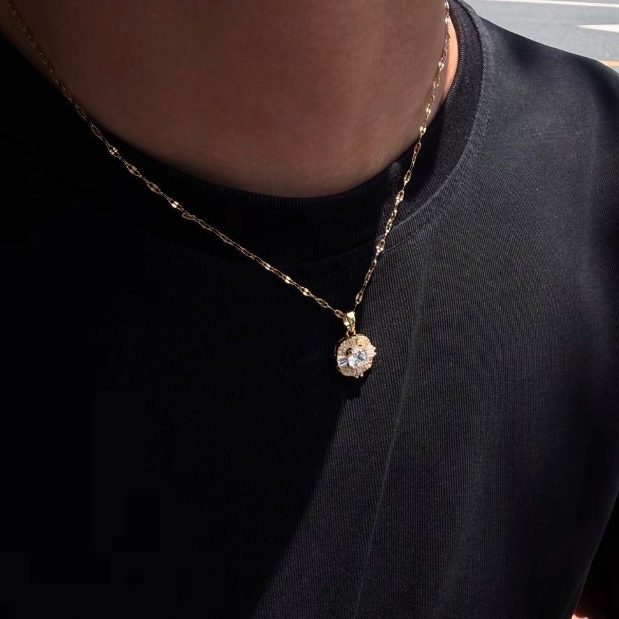 Gold-tone Radiant Halo Crystal Pendant Necklace worn with black T-shirt
